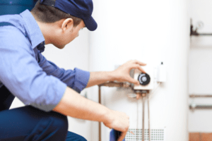 A plumber fixing the water heater issues