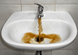 Brownish color dirty water is coming from the water tap