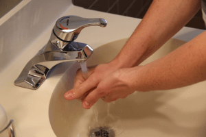 Clean and fresh water flowing from the bathroom tap