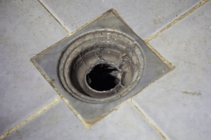 Dirty Bathroom drain without cover