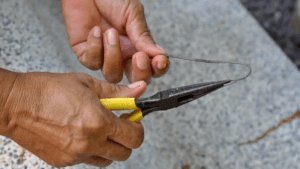 Use needle-nose pliers to pick and remove hair clumps